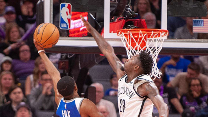 Dec 11, 2023; Sacramento, California, USA; Sacramento Kings guard De'Aaron Fox (5) puts up a shot over Brooklyn Nets forward Dorian Finney-Smith (28) during the fourth quarter at Golden 1 Center. Mandatory Credit: Ed Szczepanski-USA TODAY Sports