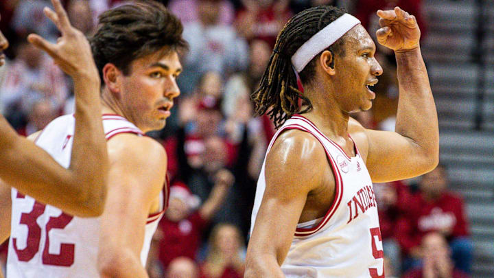 Indiana's Malik Reneau (5) holds up three fingers after making a three-pointer during the first half