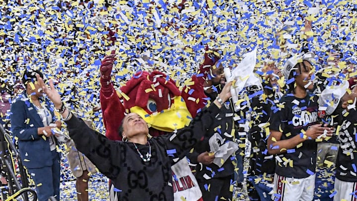 South Carolina Coach Dawn Staley celebrates with the team after the SEC Women's Basketball Tournament Championship at the Bon Secours Wellness Arena in Greenville, SC on Sunday, March 10, 2024.
