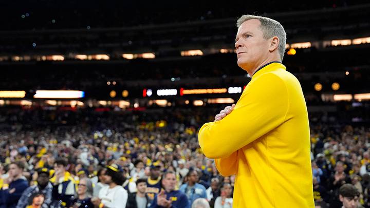 Michigan head coach Dusty May looks on from the court ahead of the NCAA national championship game against Connecticut at Lucas Oil Stadium in Indianapolis on Monday, April 6, 2026.