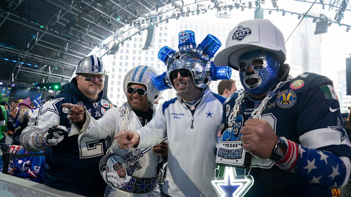 Dallas Cowboys fans pose in the main theater for the first day of the NFL Draft in Detroit. Dallas Cowboys fans pose in the main theater for the first day of the NFL Draft in Detroit.