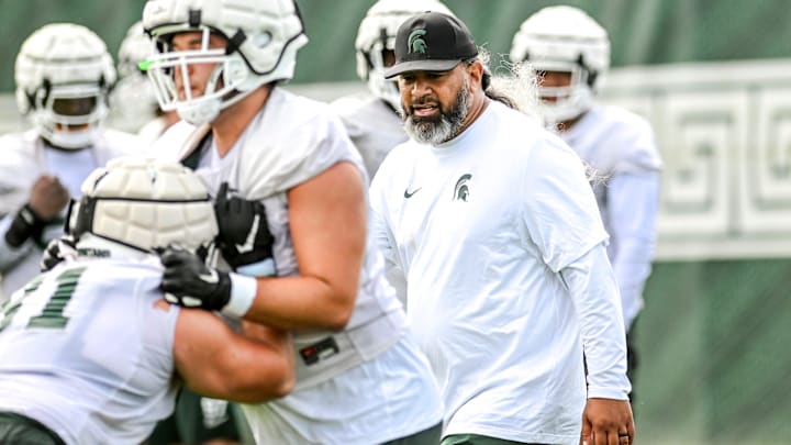 Michigan State's defensive line coach Legi Suiaunoa works with players during the first day of football camp on Tuesday, July 30, 2024, in East Lansing. Michigan State's defensive line coach Legi Suiaunoa works with players during the first day of football camp on Tuesday, July 30, 2024, in East Lansing.