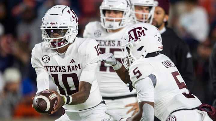 Texas A&M Aggies quarterback Marcel Reed (10) hands the ball off to running back Amari Daniels (5) during warm ups before Auburn Tigers take on Texas A&M Aggies at Jordan-Hare Stadium in Auburn, Ala., on Saturday, Sept. 7, 2024. Texas A&M Aggies quarterback Marcel Reed (10) hands the ball off to running back Amari Daniels (5) during warm ups before Auburn Tigers take on Texas A&M Aggies at Jordan-Hare Stadium in Auburn, Ala., on Saturday, Sept. 7, 2024.