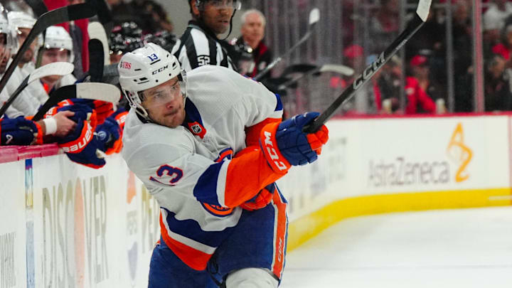 Apr 30, 2024; Raleigh, North Carolina, USA; New York Islanders center Mathew Barzal (13) takes a shot against the Carolina Hurricanes during the second period in game five of the first round of the 2024 Stanley Cup Playoffs at PNC Arena. Mandatory Credit: James Guillory-USA TODAY Sports