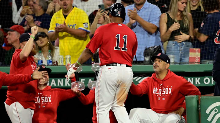 Sep 14, 2023; Boston, Massachusetts, USA; Boston Red Sox designated hitter Rafael Devers (11) celebrates his home run against the New York Yankees with manager Alex Cora (13) during the third inning at Fenway Park. Mandatory Credit: Eric Canha-Imagn Images