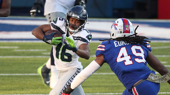 Seattle Seahawks receiver Tyler Lockett (16) tries to escape a tackle by Buffalo's Tremaine Edmunds. Seattle Seahawks receiver Tyler Lockett (16) tries to escape a tackle by Buffalo's Tremaine Edmunds.