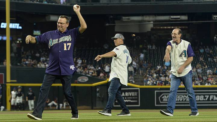 Sep 4, 2021; Phoenix, Arizona, USA; Arizona Diamondbacks former players Mark Grace (left) and Luis Gonzalez and former manager Bob Brenly (right) throw out the first pitches during a celebration for the 2001 World Series team prior to a game against the Seattle Mariners at Chase Field. Mandatory Credit: Joe Camporeale-USA TODAY Sports Sep 4, 2021; Phoenix, Arizona, USA; Arizona Diamondbacks former players Mark Grace (left) and Luis Gonzalez and former manager Bob Brenly (right) throw out the first pitches during a celebration for the 2001 World Series team prior to a game against the Seattle Mariners at Chase Field. Mandatory Credit: Joe Camporeale-USA TODAY Sports