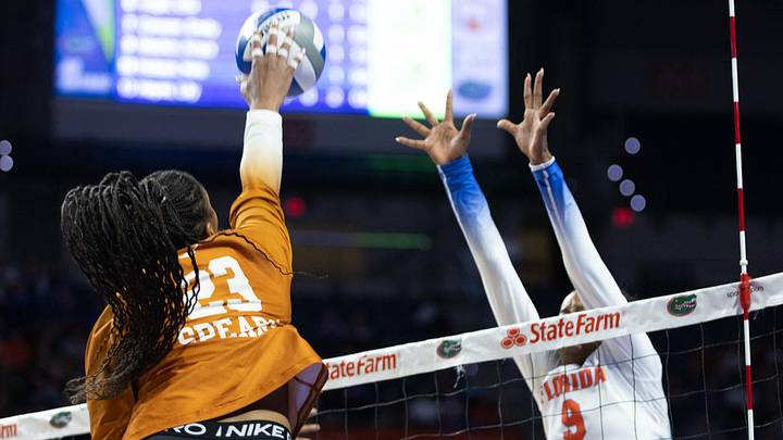 Texas outside hitter Cari Spears hits past Florida outside hitter Aniya Madkin. Texas outside hitter Cari Spears hits past Florida outside hitter Aniya Madkin.