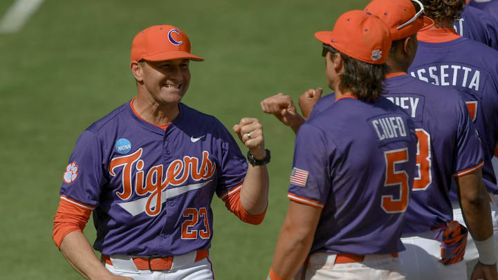 Clemson Head Coach Erik Bakich fist bumps teammates as he is introduced before the game with Clemson and University of South Carolina at the Reedy River Rivalry game at Fluor Field in Greenville, S.C. Saturday, March 1, 2025.