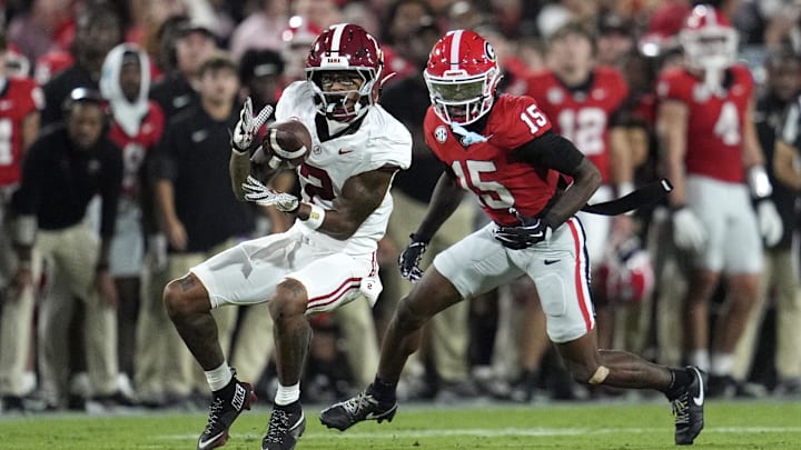 Sep 27, 2025; Athens, Georgia, USA; Alabama Crimson Tide wide receiver Ryan Williams (2) makes a catch against Georgia Bulldogs defensive back Demello Jones (15) in the first quarter at Sanford Stadium. Mandatory Credit: Dale Zanine-Imagn Images