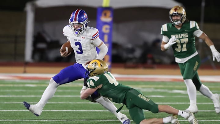 St. Bonaventure's Dylan Dunst tackles Folsom quarterback Ryder Lyons during the fourth quarter of the CIF-State Division 1-A state championship bowl at Saddleback College in Mission Viejo on Saturday, Dec. 9, 2023. Lyons and the Bulldogs won, 20-14.