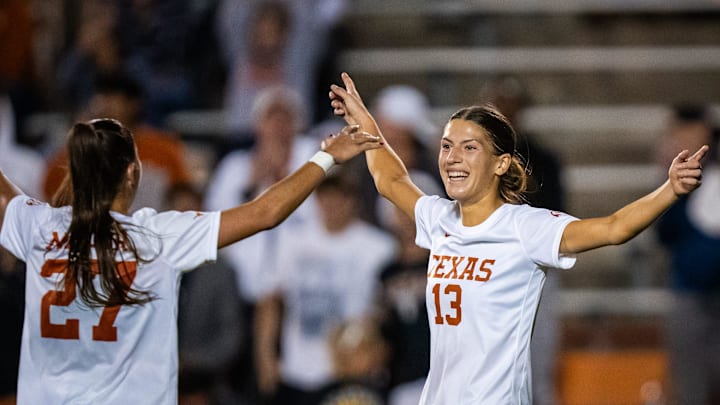 Texas Longhorns forward Holly Ward (13) celebrates her fourth goal of the game with midfielder Ashlyn Miller (27) in the second half of the Longhorns' first-round NCAA Division I Women's Soccer Championship match against Boston University at Mike Myers Stadium in Austin, Nov. 15, 2024.