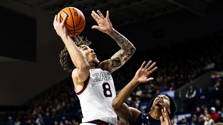 Gonzaga Bulldogs forward Jalen Warley attempts a shot over North Florida Ospreys guard Devin Hines. Gonzaga Bulldogs forward Jalen Warley attempts a shot over North Florida Ospreys guard Devin Hines.