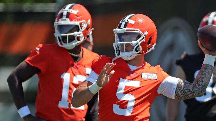 Cleveland Browns quarterback Dillon Gabriel (5) throws as quarterback Shedeur Sanders (12) looks on during NFL rookie minicamp at the Cleveland Browns training facility on Friday, May 9, 2025, in Berea, Ohio. Cleveland Browns quarterback Dillon Gabriel (5) throws as quarterback Shedeur Sanders (12) looks on during NFL rookie minicamp at the Cleveland Browns training facility on Friday, May 9, 2025, in Berea, Ohio.