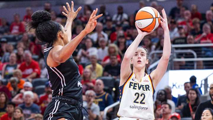 Jul 9, 2025; Indianapolis, Indiana, USA; Indiana Fever guard Caitlin Clark (22) shoots the ball while Golden State Valkyries forward Monique Billings (25) defends in the first half at Gainbridge Fieldhouse. Mandatory Credit: Trevor Ruszkowski-Imagn Images Jul 9, 2025; Indianapolis, Indiana, USA; Indiana Fever guard Caitlin Clark (22) shoots the ball while Golden State Valkyries forward Monique Billings (25) defends in the first half at Gainbridge Fieldhouse. Mandatory Credit: Trevor Ruszkowski-Imagn Images