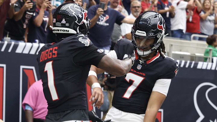 Sep 29, 2024; Houston, Texas, USA; Houston Texans quarterback C.J. Stroud (7) celebrates with wide receiver Stefon Diggs (1) following a first quarter touchdown against the Jacksonville Jaguars at NRG Stadium. Mandatory Credit: Thomas Shea-Imagn Images