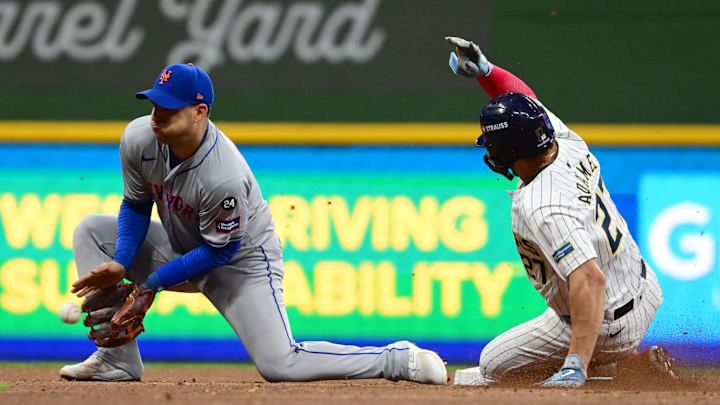 Oct 3, 2024; Milwaukee, Wisconsin, USA; Milwaukee Brewers shortstop Willy Adames (27) steals second base against New York Mets second baseman Jose Iglesias (11) in the fourth inning during game three of the Wildcard round for the 2024 MLB Playoffs at American Family Field. Mandatory Credit: Benny Sieu-Imagn Images