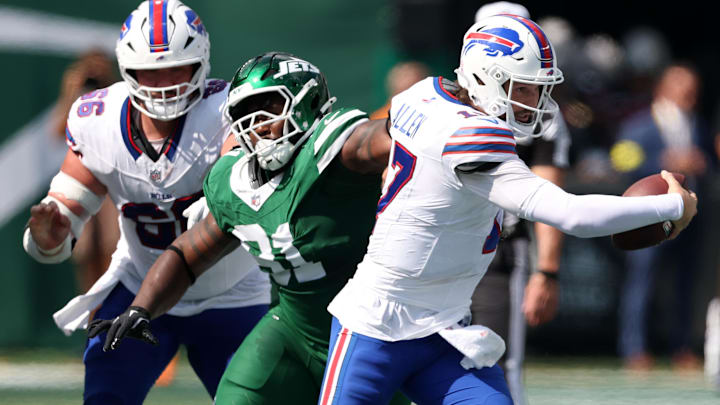 Buffalo Bills quarterback Josh Allen rushes the ball against the New York Jets.