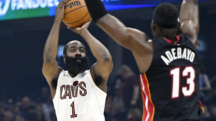 Mar 25, 2026; Cleveland, Ohio, USA; Cleveland Cavaliers guard James Harden (1) shoots beside Miami Heat center Bam Adebayo (13) in the third quarter at Rocket Arena. Mandatory Credit: David Richard-Imagn Images