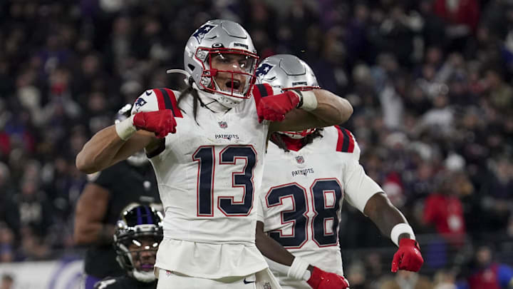 Dec 21, 2025; Baltimore, Maryland, USA;  New England Patriots wide receiver Mack Hollins (13) celebrates a catch against Baltimore Ravens safety Kyle Hamilton (14) with New England Patriots running back Rhamondre Stevenson (38) during the first half of the game at M&T Bank Stadium. Mandatory Credit: James Lang-Imagn Images