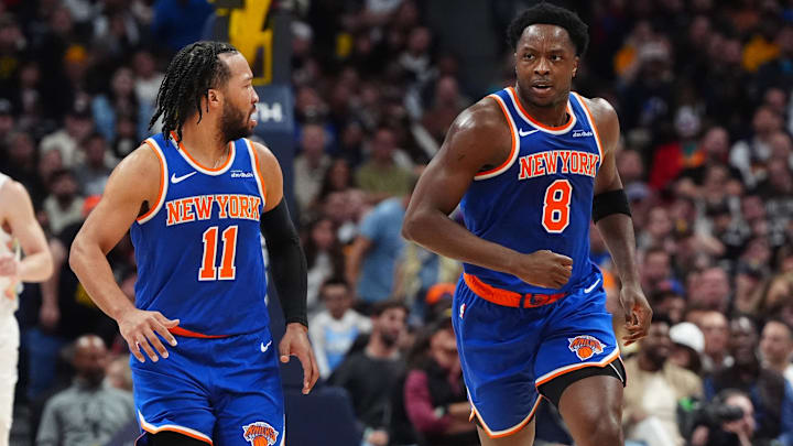 Nov 25, 2024; Denver, Colorado, USA; New York Knicks guard Jalen Brunson (11) reacts towards forward OG Anunoby (8) in the second quarter against the Denver Nuggets at Ball Arena. Mandatory Credit: Ron Chenoy-Imagn Images
