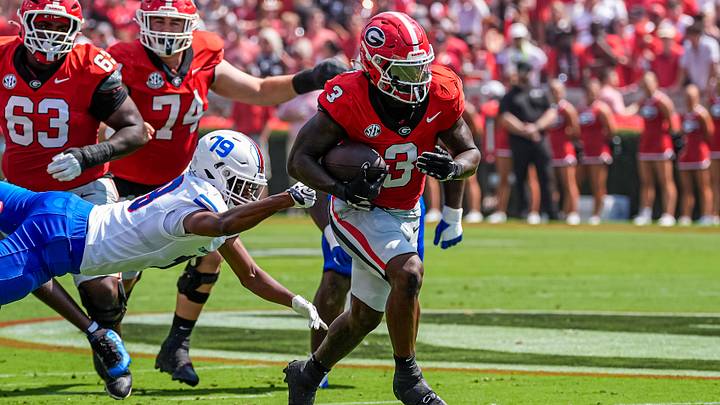 Sep 5, 2026; Athens, Georgia, USA; Georgia Bulldogs running back Nate Frazier (3) breaks a tackle by Tennessee State Tigers safety Joshua Reese (19) on his way to a touchdown during the first quarter at Sanford Stadium. Mandatory Credit: Dale Zanine-Imagn Images Sep 5, 2026; Athens, Georgia, USA; Georgia Bulldogs running back Nate Frazier (3) breaks a tackle by Tennessee State Tigers safety Joshua Reese (19) on his way to a touchdown during the first quarter at Sanford Stadium. Mandatory Credit: Dale Zanine-Imagn Images