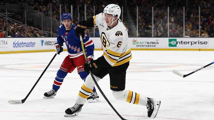 Jan 10, 2026; Boston, Massachusetts, USA; Boston Bruins defenseman Mason Lohrei (6) fires a shot as New York Rangers right wing Gabe Perreault (94) looks on during the first period at TD Garden. Mandatory Credit: Winslow Townson-Imagn Images Jan 10, 2026; Boston, Massachusetts, USA; Boston Bruins defenseman Mason Lohrei (6) fires a shot as New York Rangers right wing Gabe Perreault (94) looks on during the first period at TD Garden. Mandatory Credit: Winslow Townson-Imagn Images