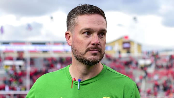 Oct 28, 2023; Salt Lake City, Utah, USA; Oregon Ducks head coach Dan Lanning congratulates players after defeating the Utah Utes at Rice-Eccles Stadium. Mandatory Credit: Christopher Creveling-Imagn Images