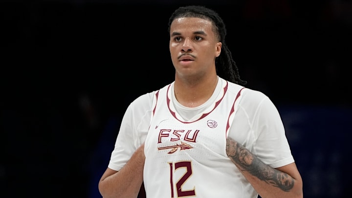 Mar 11, 2025; Charlotte, NC, USA; Florida State Seminoles forward Malique Ewin (12) on the court in the first half at Spectrum Center. Mandatory Credit: Bob Donnan-Imagn Images
