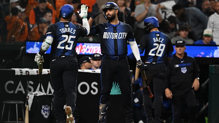 Jun 13, 2025; Detroit, Michigan, USA; Detroit Tigers second base Gleyber Torres (25) celebrates with left fielder Riley Greene (31) after driving in a run with a sacrifice fly against the Cincinnati Reds in the sixth inning at Comerica Park.