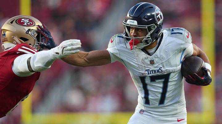 Dec 14, 2025; Santa Clara, California, USA;  Tennessee Titans wide receiver Chimere Dike (17) stiff arms a San Francisco 49ers player during the fourth quarter at Levi's Stadium. Mandatory Credit: Cary Edmondson-Imagn Images