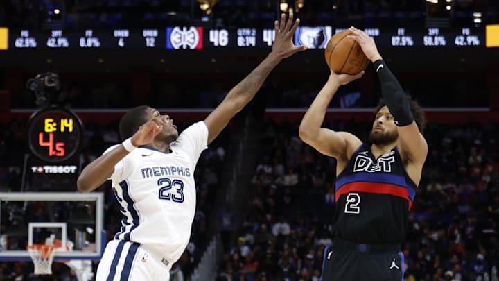 Mar 13, 2026; Detroit, Michigan, USA;  Detroit Pistons guard Cade Cunningham (2) shoots on Memphis Grizzlies forward Cedric Coward (23) in the first half at Little Caesars Arena. Mandatory Credit: Rick Osentoski-Imagn Images