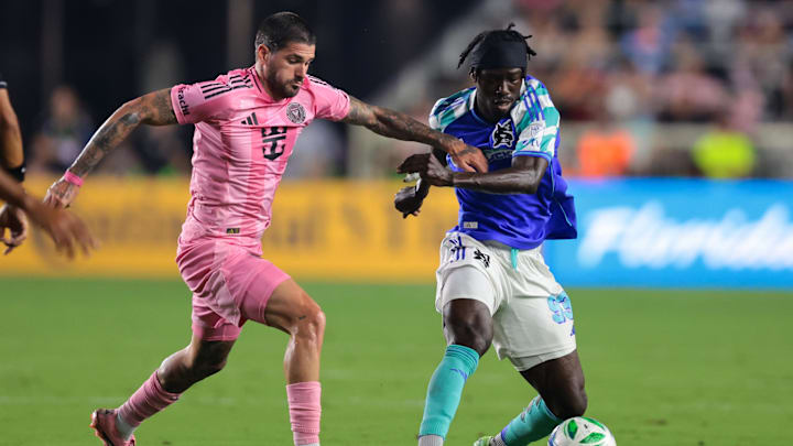 Sep 16, 2025; Fort Lauderdale, Florida, USA; Seattle Sounders forward Georgi Minoungou (93) dribbles the ball against Inter Miami CF midfielder Rodrigo De Paul (7) during the first half at Chase Stadium. Mandatory Credit: Sam Navarro-Imagn Images