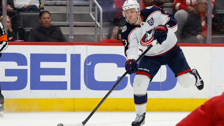 Apr 7, 2026; Detroit, Michigan, USA;  Columbus Blue Jackets center Charlie Coyle (3) takes a shot in the first period against the Detroit Red Wings at Little Caesars Arena. Mandatory Credit: Rick Osentoski-Imagn Images