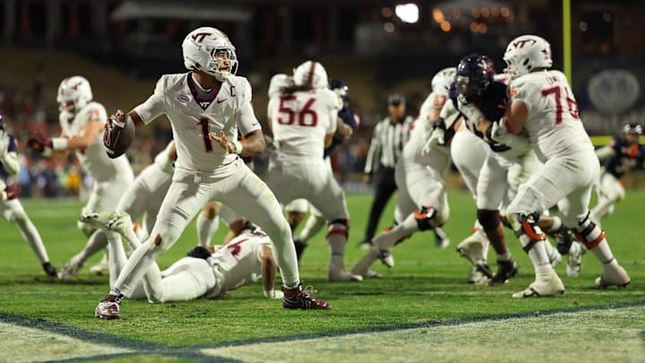 Nov 29, 2025; Charlottesville, Virginia, USA; Virginia Tech Hokies quarterback Kyron Drones (1) passes the ball from his own end zone against the Virginia Cavaliers in the third quarter at Scott Stadium. Mandatory Credit: Geoff Burke-Imagn Images