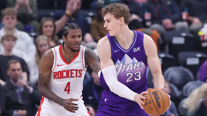 Feb 22, 2025; Salt Lake City, Utah, USA; Utah Jazz forward Lauri Markkanen (23) posts up against Houston Rockets guard Jalen Green (4) during the second half at Delta Center. Mandatory Credit: Rob Gray-Imagn Images