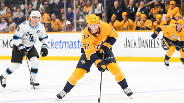 Apr 14, 2025; Nashville, Tennessee, USA;  Nashville Predators right wing Matthew Wood (52)  skates with the puck against the Utah Hockey Club during the third period at Bridgestone Arena. Mandatory Credit: Steve Roberts-Imagn Images