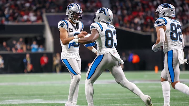 Jan 5, 2025; Atlanta, Georgia, USA; Carolina Panthers quarterback Bryce Young (9) celebrates with wide receiver David Moore (83) after a touchdown pass against the Atlanta Falcons in the third quarter at Mercedes-Benz Stadium. Mandatory Credit: Brett Davis-Imagn Images Jan 5, 2025; Atlanta, Georgia, USA; Carolina Panthers quarterback Bryce Young (9) celebrates with wide receiver David Moore (83) after a touchdown pass against the Atlanta Falcons in the third quarter at Mercedes-Benz Stadium. Mandatory Credit: Brett Davis-Imagn Images