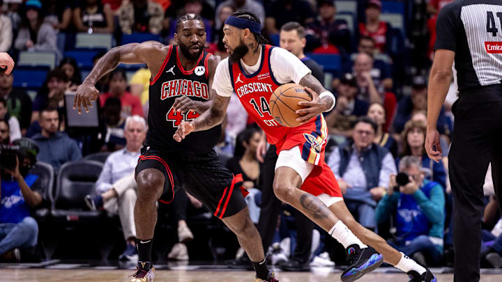 Oct 23, 2024; New Orleans, Louisiana, USA; New Orleans Pelicans forward Brandon Ingram (14) dribbles against Chicago Bulls forward Patrick Williams (44) during the first half at Smoothie King Center. Oct 23, 2024; New Orleans, Louisiana, USA; New Orleans Pelicans forward Brandon Ingram (14) dribbles against Chicago Bulls forward Patrick Williams (44) during the first half at Smoothie King Center.