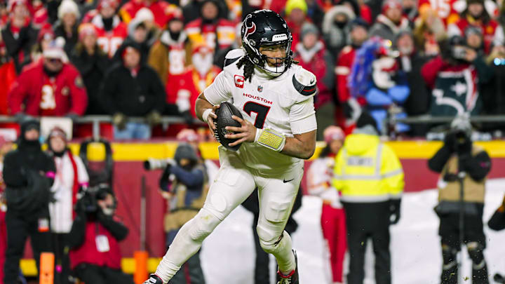 Jan 18, 2025; Kansas City, Missouri, USA; Houston Texans quarterback C.J. Stroud (7) rolls out to pass during the second half against the Kansas City Chiefs in a 2025 AFC divisional round game at GEHA Field at Arrowhead Stadium. Mandatory Credit: Jay Biggerstaff-Imagn Images