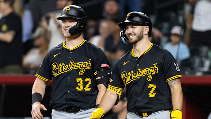 May 27, 2025; Phoenix, Arizona, USA; Pittsburgh Pirates catcher Henry Davis (left) and first baseman Spencer Horwitz against the Arizona Diamondbacks at Chase Field. Mandatory Credit: Mark J. Rebilas-Imagn Images