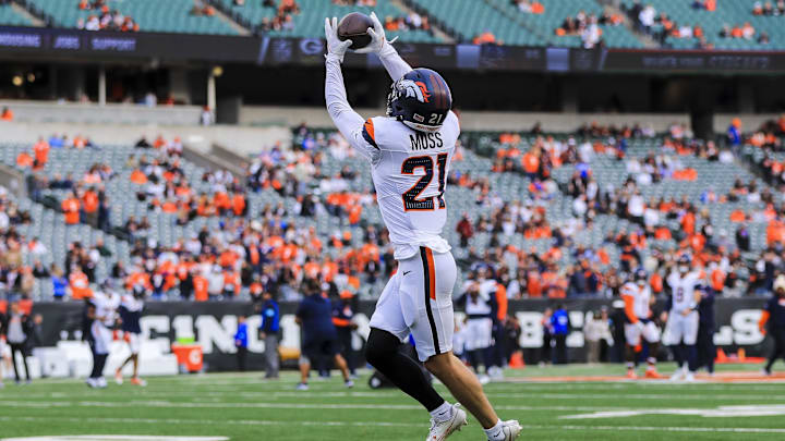 Dec 28, 2024; Cincinnati, Ohio, USA; Denver Broncos cornerback Riley Moss (21) catches a pass during warmups before the game against the Cincinnati Bengals at Paycor Stadium. Mandatory Credit: Katie Stratman-Imagn Images