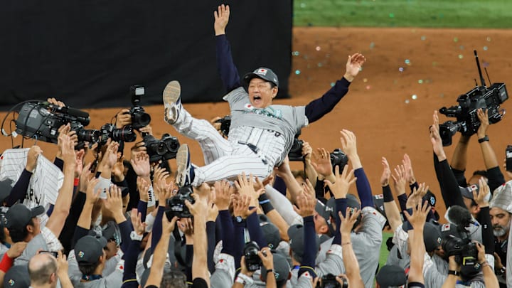 Mar 21, 2023; Miami, Florida, USA; Japan manager Hideki Kuriyama (89) celebrates after defeating Team USA to win the World Baseball Classic at LoanDepot Park. Mandatory Credit: Sam Navarro-Imagn Images