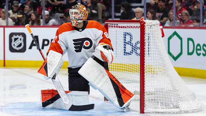 Apr 13, 2025; Ottawa, Ontario, CAN; Philadelphia Flyers goalie Ivan Fedotov (82) stretches prior to the start of game against the Ottawa Senators at the Canadian Tire Centre. Mandatory Credit: Marc DesRosiers-Imagn Images