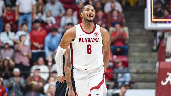 Feb 25, 2025; Tuscaloosa, Alabama, USA; Alabama Crimson Tide guard Chris Youngblood (8) celebrates after a three point basket against the Mississippi State Bulldogs during the first half at Coleman Coliseum. Mandatory Credit: Will McLelland-Imagn Images