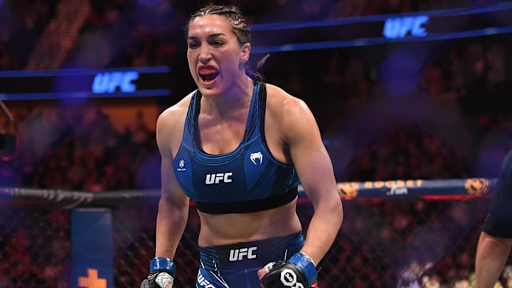 Aug 5, 2023; Nashville, Tennessee, USA;  Tatiana Suarez (blue gloves) celebrates the win by