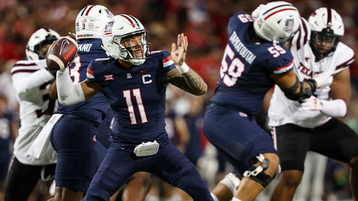 Oct 5, 2024; Tucson, Arizona, USA; Arizona Wildcats quarterback Noah Fifita (11) throws ball during first quarter against Texas Tech Red Raiders at Arizona Stadium. 
