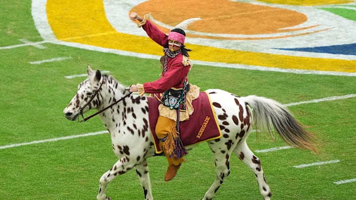 Dec 30, 2023; Miami Gardens, FL, USA; Florida State Seminoles mascot Chief Osceola and Renegade take the field before the game in the 2023 Orange Bowl against the Georgia Bulldogs at Hard Rock Stadium. Mandatory Credit: Jasen Vinlove-Imagn Images