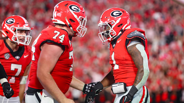 Georgia Bulldogs running back Trevor Etienne (1) celebrates with offensive lineman Drew Bobo after a touchdown.
