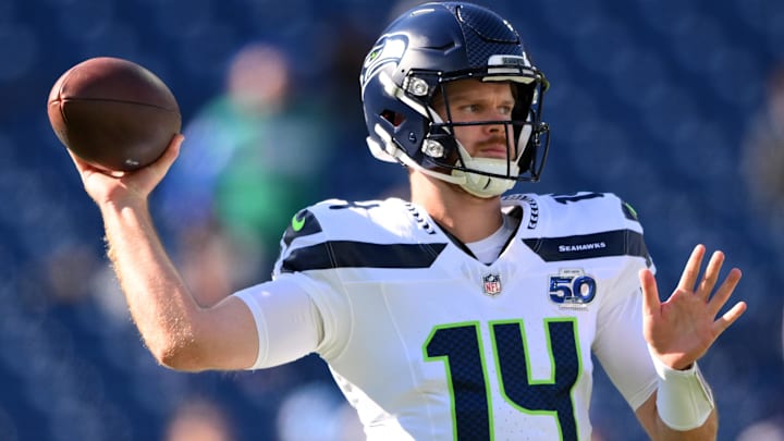 Nov 23, 2025; Nashville, Tennessee, USA; Seattle Seahawks quarterback Sam Darnold (14) warms up before a game against the Tennessee Titans at Nissan Stadium. Nov 23, 2025; Nashville, Tennessee, USA; Seattle Seahawks quarterback Sam Darnold (14) warms up before a game against the Tennessee Titans at Nissan Stadium.